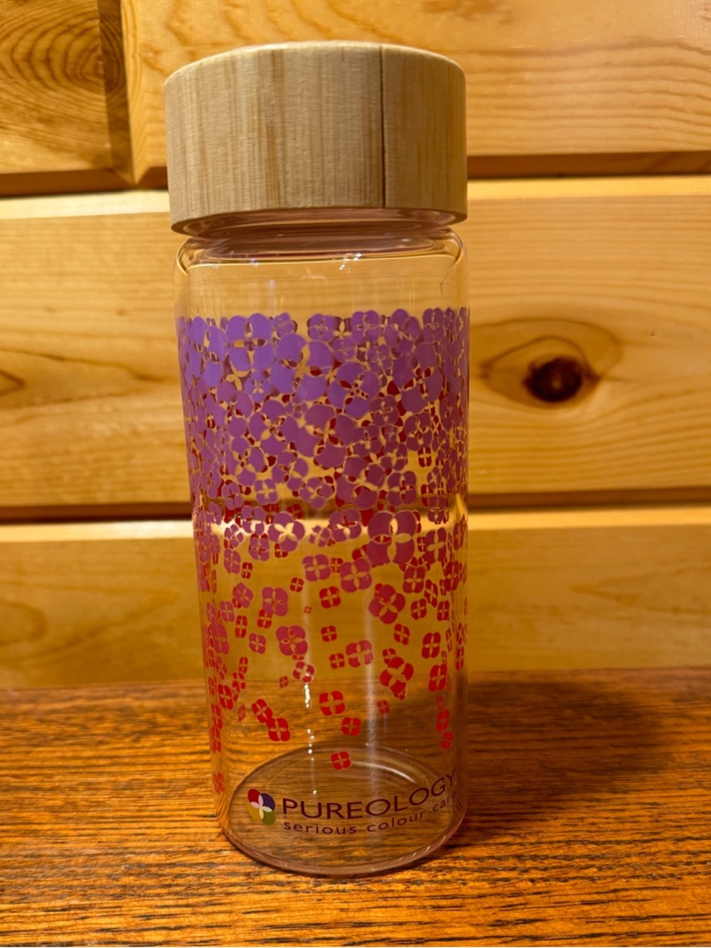 Pureology Glass Water Bottle with Bamboo Lid in Purple and Pink Floral ombré